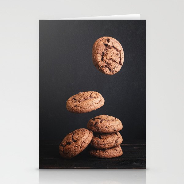 Delicious fresh chocolate cookies stacked on a wooden table Stationery Cards