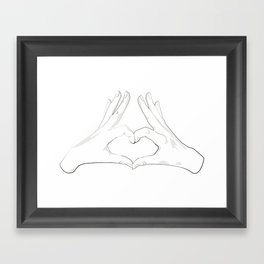 hand forming a heart shape Framed Art Print