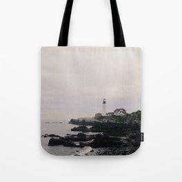 Lighthouse on the coast Tote Bag