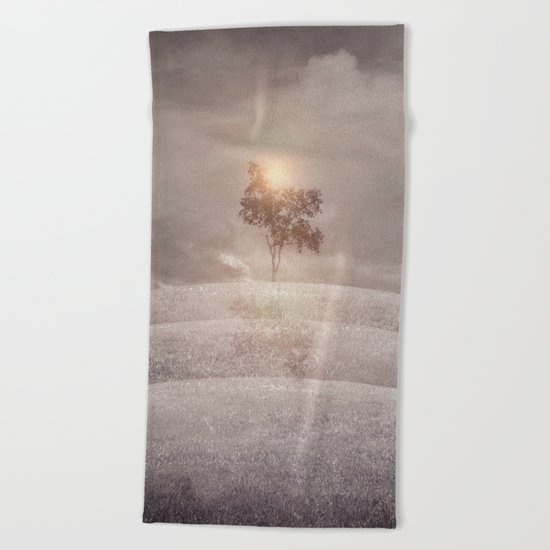 The lone tree Beach Towel
