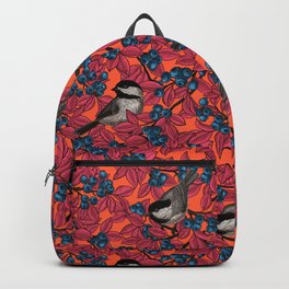 Chickadee birds on blueberry branches in red Backpack