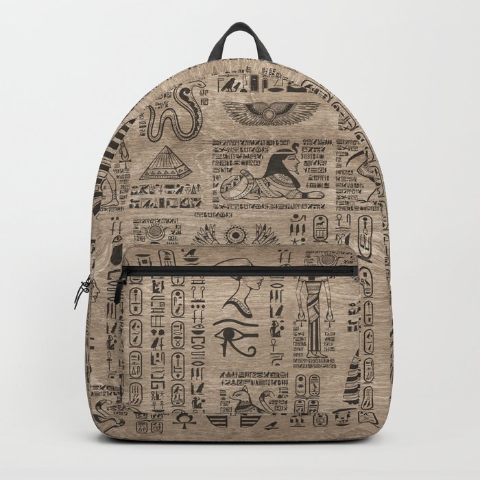 Egyptian hieroglyphs and symbols on wood Backpack
