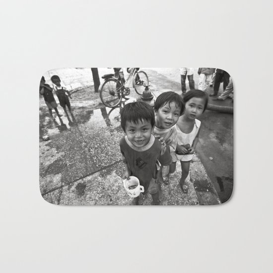 Vietnamese Children with a goldfish Bath Mat