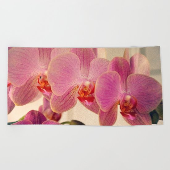 Triplet pink orchids Beach Towel