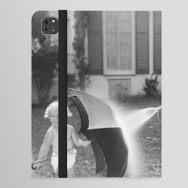 Always look on the bright side of life; little girl thwarting father with hose using umbrella humorous funny black and white photograph - photography - photograph iPad Folio Case
