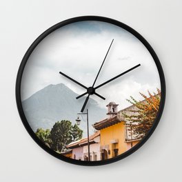 Colorful houses of a street in Antigua Guatemala with volcano views Wall Clock