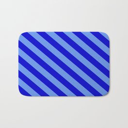 [ Thumbnail: Cornflower Blue & Blue Colored Lined Pattern Bath Mat ]
