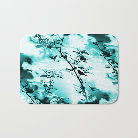 Silhouette of songbird on a branch in turquoise variation Bath Mat
