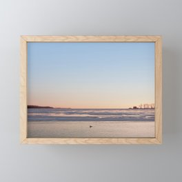 A Lone Bird Swims in a Frozen Lake on January 29th, 2022. Framed Mini Art Print