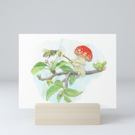 A little mushroom meets a bee Mini Art Print
