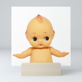 Cute little naked baby doll. Mini Art Print