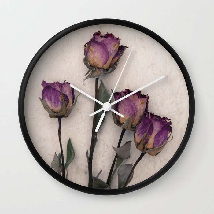 four dried roses Wall Clock by Maria Heyens