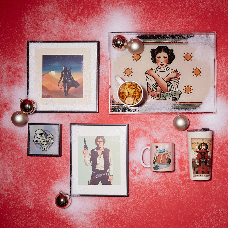 flatlay with Star Wars-themed framed prints, mugs and more