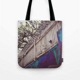 cat in fence Tote Bag