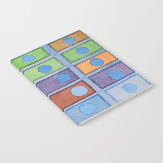 Blue Circles Passing Through Notebook