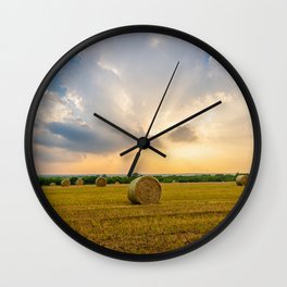 The Best of Times - Round Hay Bales Under a Stormy Sky Filled with Golden Sunlight in Oklahoma Wall Clock