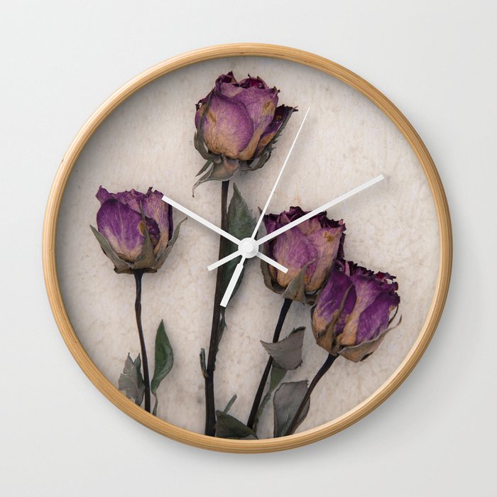 four dried roses Wall Clock by Maria Heyens