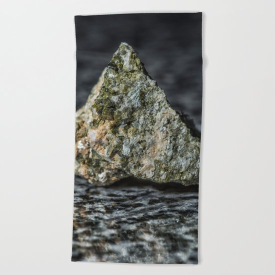 Epidote resting on granite Beach Towel