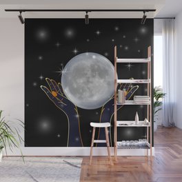 Womans hands holding the moon on a starry night Wall Mural