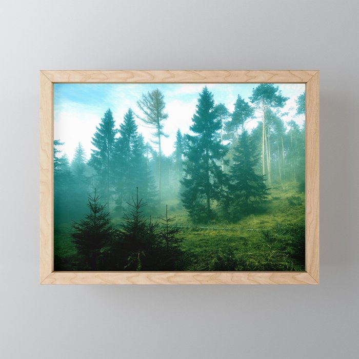 Emerald green forest with trees in the fog Framed Mini Art Print