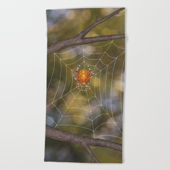 marbled orb weaver on a web Beach Towel