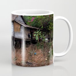 Picturesque Stilt house on the Mekong River Bank, Laos Coffee Mug