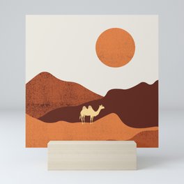 a lost camel in the desert Mini Art Print