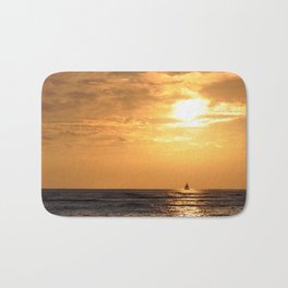 Sunset with sailboat Bath Mat