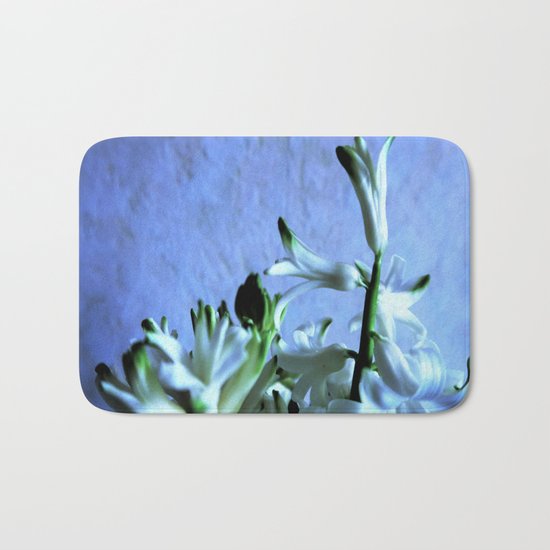 white hyacinthe on light blue background Bath Mat