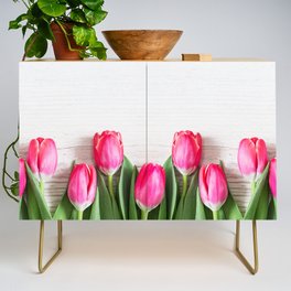 Beautiful pink tulips on wooden background. Credenza