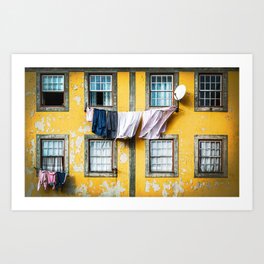 Beautiful and traditional facade of old building with clothes hanging from clothesline in windows. Art Print