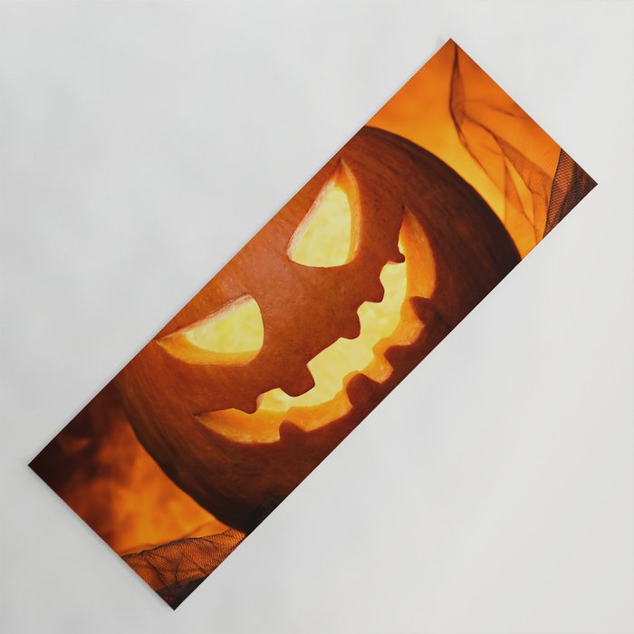 Carved Pumpkin for Halloween on Dark Background Yoga Mat