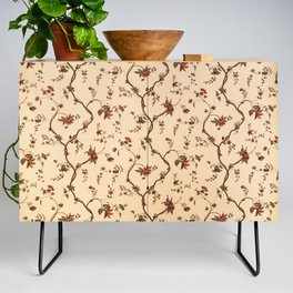 Vintage wallpaper with branches and flowers faded and bleached by sunlight Credenza