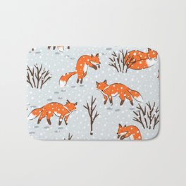 Foxes in the snow Bath Mat