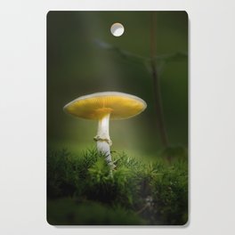 Brightly lit fungus in the forest Cutting Board