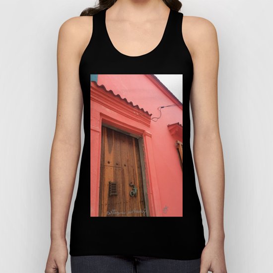 Cartagena is Peachy, Colombia, South America. Coral Pink Building with Ornate Lizard design Unisex Tank Top
