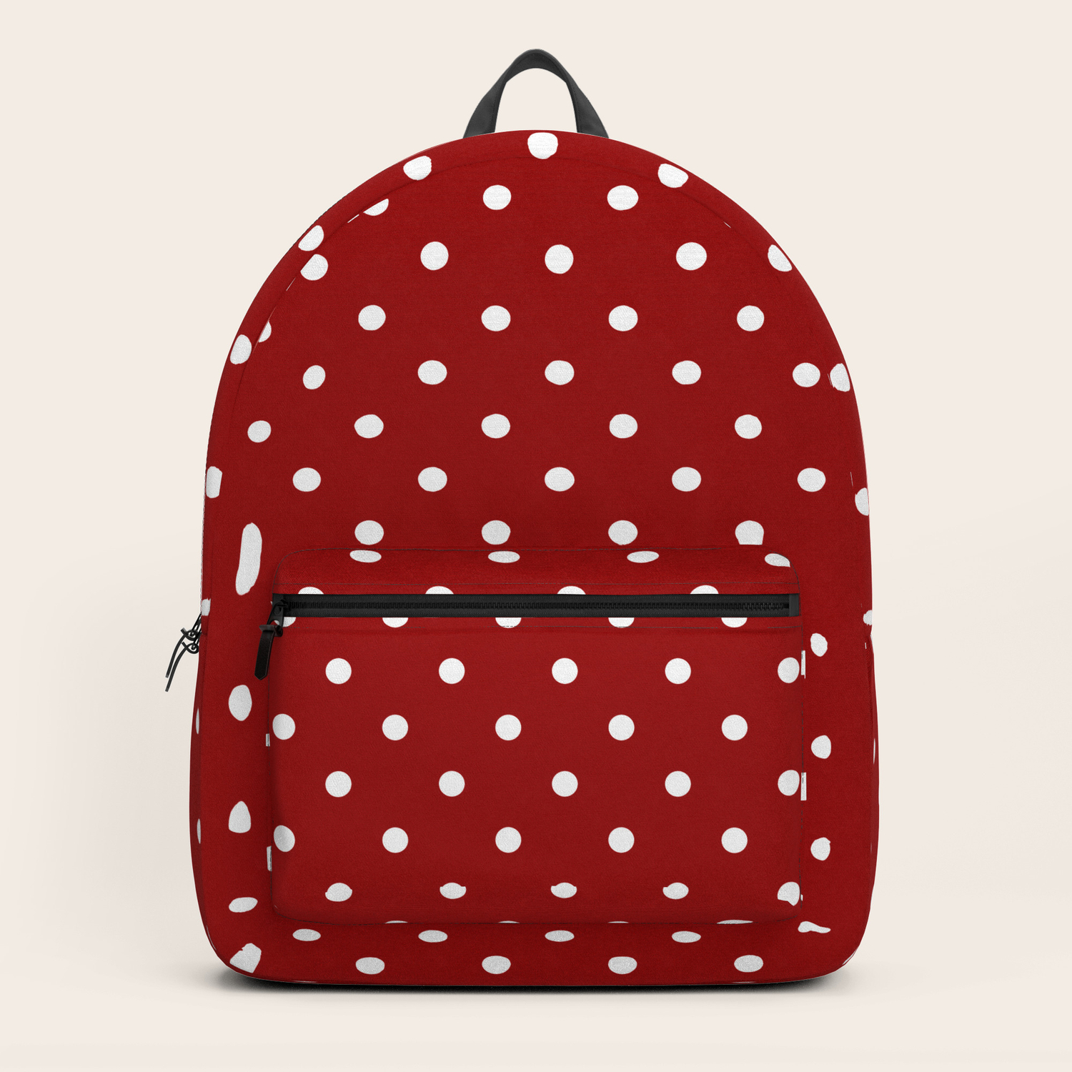 red polka dot backpack