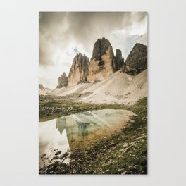 The famous Three Peaks reflecting in a clear Mountain Lake Canvas Print
