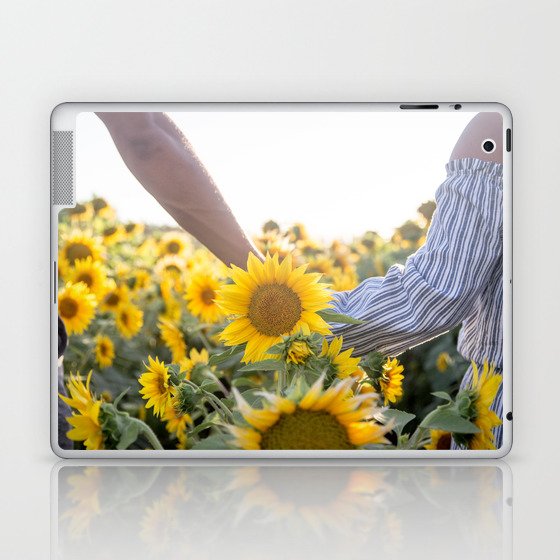 Couple holding hands in a sunflower field Laptop & iPad Skin