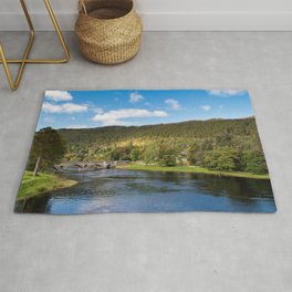 Autumnal view of Kenmore in Perthshire in Scotland Rug