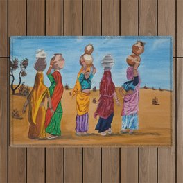 Indian women chit chatting and gossiping while crossing a desert to fetch some water by Abha Outdoor Rug