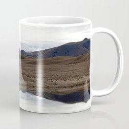 Reflections of the Rolling Hills and Snow-Covered Mountains on the Road to Edoras Coffee Mug