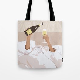 Woman in bed with bottle of champagne Tote Bag