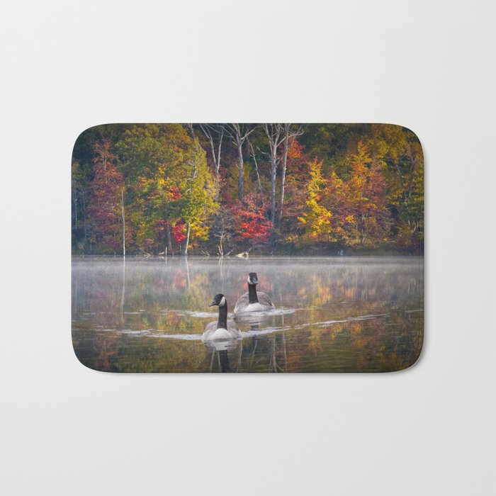 Two Canada Geese swimming in Fall Bath Mat