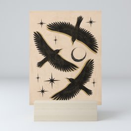 Black birds flying with the Moon Mini Art Print