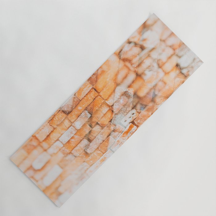 Retro style background or texture in double exposure. The stonewall from old orange bricks.  Yoga Mat