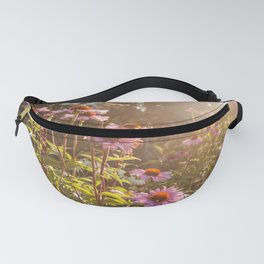 Sun setting on purple coneflower garden with bee on flower Fanny Pack