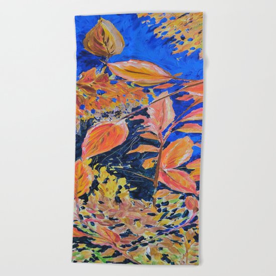 colored autumnleaves under the blue sky Beach Towel