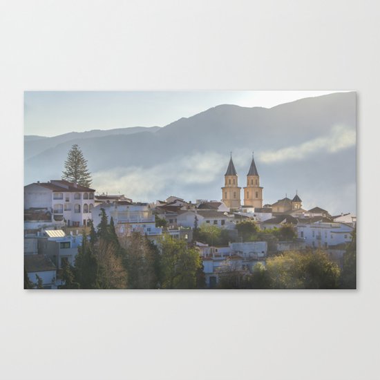 Twin spires of Orgiva town church Canvas Print