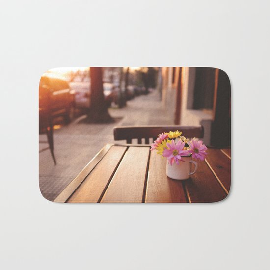 Flowers in the street Bath Mat